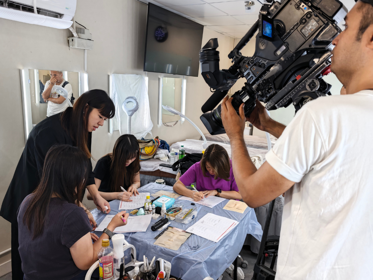 Image 4: Semi-permanent makeup students practicing on synthetic skin