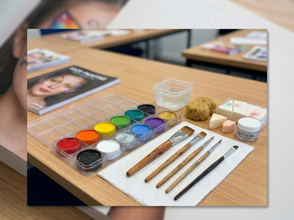 Professional face painting tools and pigments – water‑based cream paints, brushes (flat, round, angled), sponges, palette – standard IQA course equipment